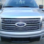Before and after photographs of a damaged Ford pickup truck that was repaired by Elite Paint & Body Shop in West Palm Beach, Florida.